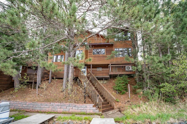 8845 Pequaywan Lake Rd, Duluth, MN 55803 - rustic home with stairway and a wooden deck