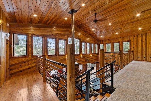8845 Pequaywan Lake Rd, Duluth, MN 55803 - hallway featuring an upstairs landing, wood walls, wood ceiling, vaulted ceiling, and light wood-style flooring
