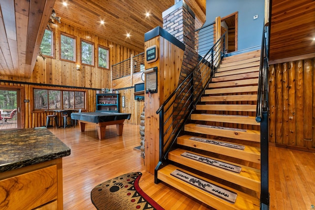 8845 Pequaywan Lake Rd, Duluth, MN 55803 - stairway featuring wooden walls, a high ceiling, wooden ceiling, plenty of natural light, and billiards