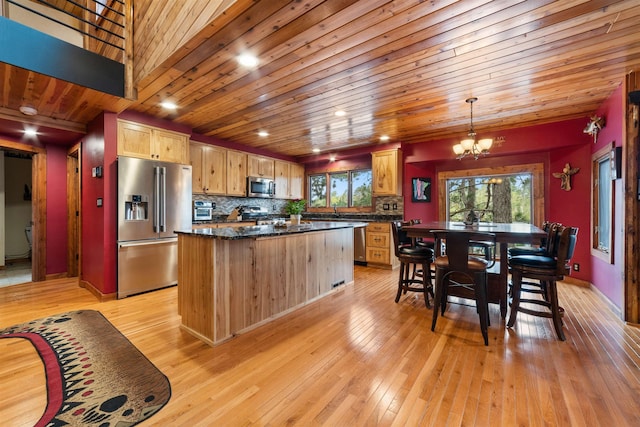 8845 Pequaywan Lake Rd, Duluth, MN 55803 - kitchen with stainless steel appliances, a chandelier, a kitchen island, light wood-type flooring, and wood ceiling