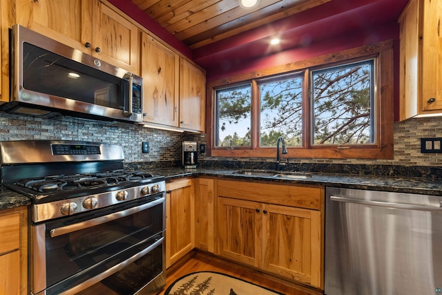 8845 Pequaywan Lake Rd, Duluth, MN 55803 - kitchen with appliances with stainless steel finishes, a sink, tasteful backsplash, dark stone counters, and wood ceiling