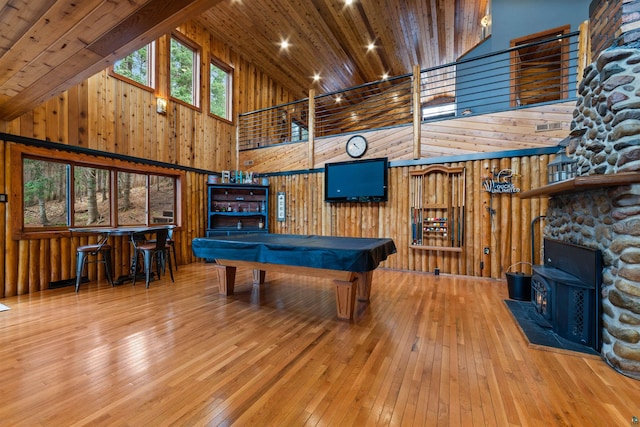 8845 Pequaywan Lake Rd, Duluth, MN 55803 - game room with a high ceiling, a wood stove, billiards, hardwood / wood-style flooring, and wood walls