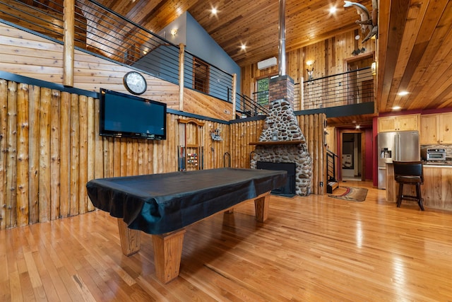 8845 Pequaywan Lake Rd, Duluth, MN 55803 - playroom featuring high vaulted ceiling, light wood-type flooring, a stone fireplace, wood walls, and wood ceiling