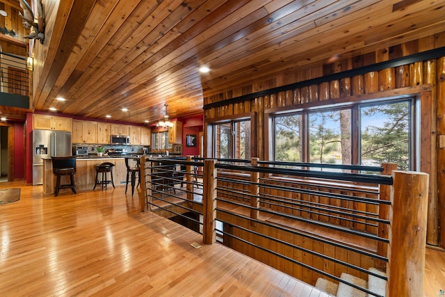 8845 Pequaywan Lake Rd, Duluth, MN 55803 - hall featuring light wood-style floors, recessed lighting, an upstairs landing, and wood ceiling