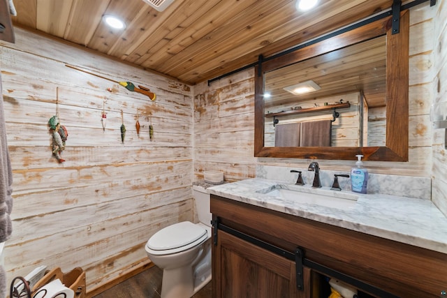8845 Pequaywan Lake Rd, Duluth, MN 55803 - bathroom featuring wooden walls, vanity, toilet, wooden ceiling, and recessed lighting