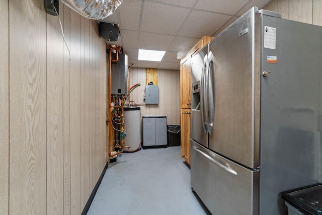 8845 Pequaywan Lake Rd, Duluth, MN 55803 - kitchen featuring stainless steel fridge with ice dispenser, electric panel, gas water heater, a paneled ceiling, and wooden walls