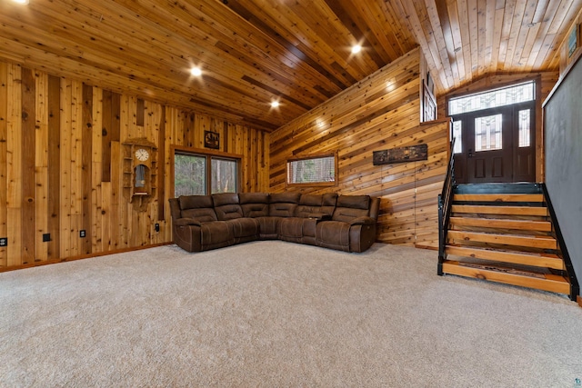 8845 Pequaywan Lake Rd, Duluth, MN 55803 - living area with lofted ceiling, wooden walls, carpet, wooden ceiling, and stairs