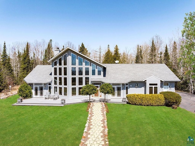 5491 N Shore Dr, Duluth, MN 55804 - rear view of property with a lawn, a chimney, french doors, and a wooden deck