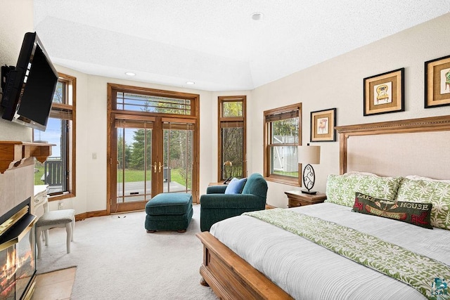 5491 N Shore Dr, Duluth, MN 55804 - bedroom featuring carpet, access to outside, french doors, a fireplace, and recessed lighting