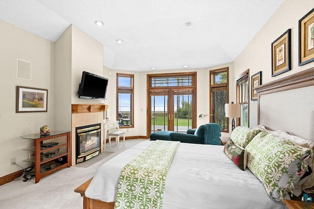 5491 N Shore Dr, Duluth, MN 55804 - bedroom with access to outside, light colored carpet, a tile fireplace, baseboards, and recessed lighting