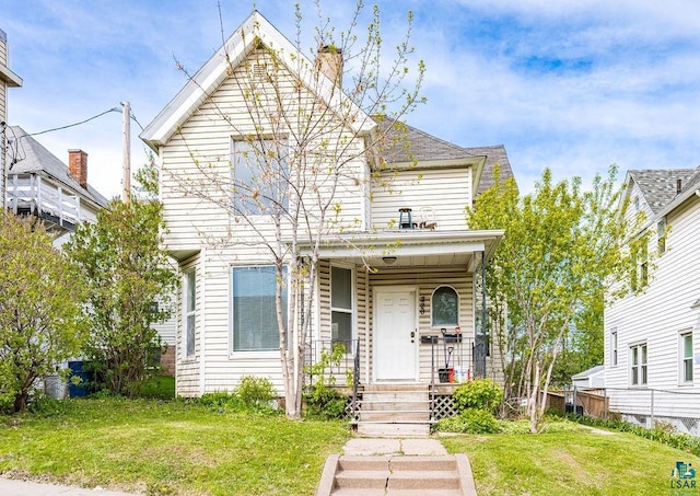 220 N 12th Ave E, Duluth, MN 55805 - view of front of property featuring a porch and a front yard