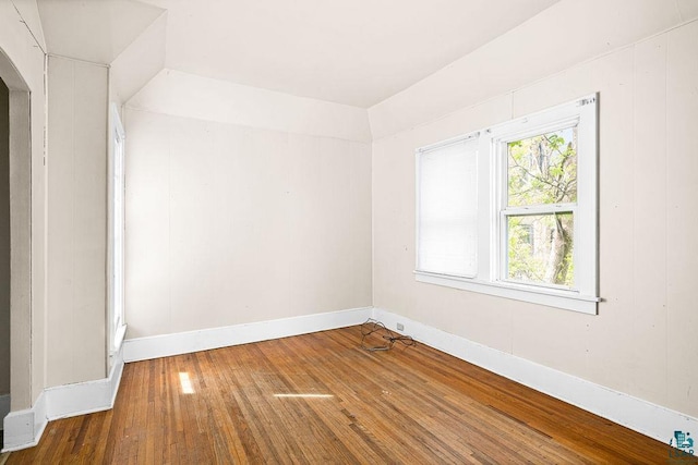 220 N 12th Ave E, Duluth, MN 55805 - empty room with wood-type flooring, arched walkways, and baseboards