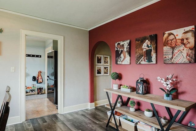 2120 Carlton Ave, Cloquet, MN 55720 - hall with crown molding, arched walkways, dark wood-type flooring, and baseboards