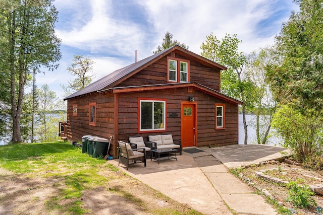 13359 Villa Rd, Ely, MN 55731 - rear view of property featuring an outdoor hangout area and a patio