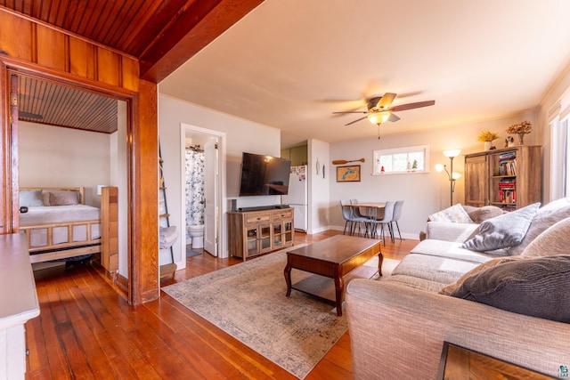 13359 Villa Rd, Ely, MN 55731 - living area featuring dark wood-style flooring, a ceiling fan, and baseboards