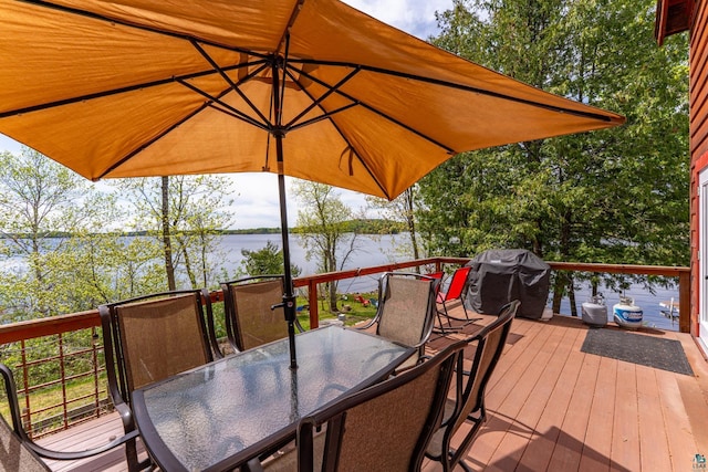 13359 Villa Rd, Ely, MN 55731 - wooden deck with outdoor dining space, a water view, and grilling area