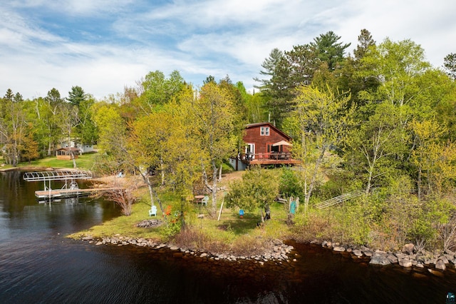 13359 Villa Rd, Ely, MN 55731 - view of yard featuring a boat dock, a water view, and a wooded view