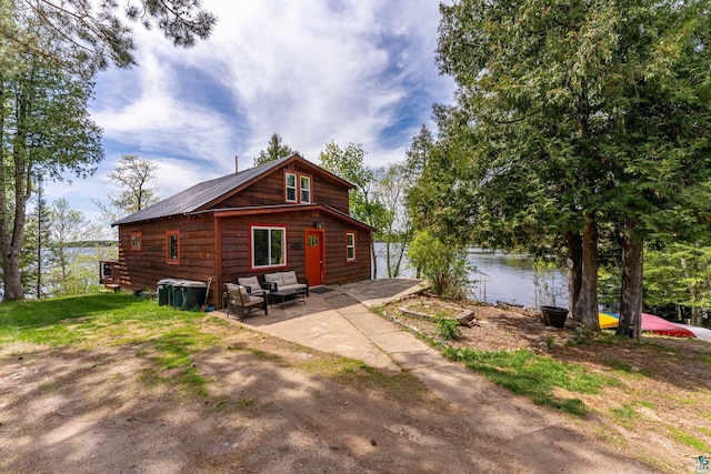 13359 Villa Rd, Ely, MN 55731 - back of house featuring a patio, a water view, and outdoor lounge area