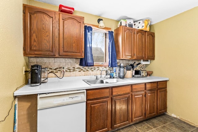 214 5th St, Proctor, MN 55810 - kitchen with dishwasher, a sink, light countertops, tasteful backsplash, and brown cabinets