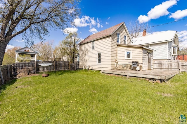 214 5th St, Proctor, MN 55810 - back of house with a wooden deck and a chimney
