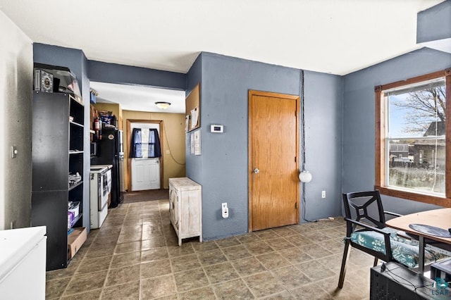 214 5th St, Proctor, MN 55810 - kitchen with white range with electric stovetop and plenty of natural light