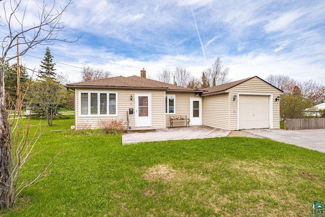 11 Aiken Crk, Silver Bay, MN 55614 - back of property with driveway, a garage, a chimney, and a shingled roof