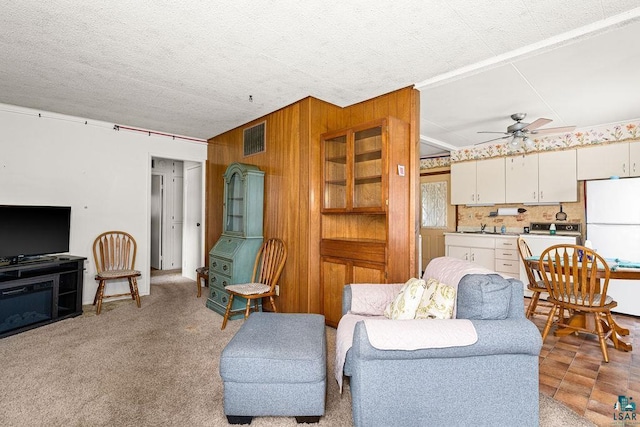 11 Aiken Crk, Silver Bay, MN 55614 - living room featuring a ceiling fan and wooden walls