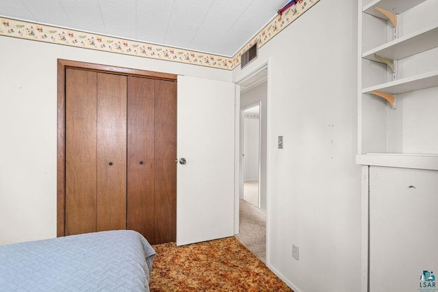 11 Aiken Crk, Silver Bay, MN 55614 - bedroom with a closet and carpet floors