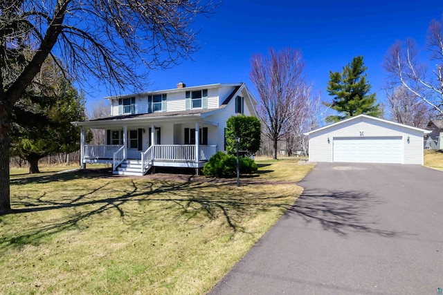 335 E Willow St, Duluth, MN 55811 - view of front of property featuring covered porch, a chimney, an outbuilding, a front lawn, and a detached garage
