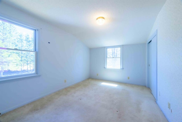 335 E Willow St, Duluth, MN 55811 - additional living space featuring light colored carpet and vaulted ceiling