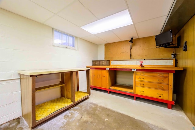 335 E Willow St, Duluth, MN 55811 - bar area with concrete flooring, a paneled ceiling, a workshop area, and concrete block wall