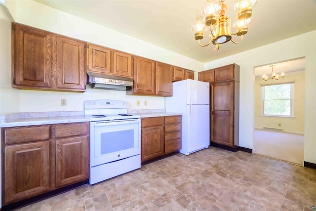 335 E Willow St, Duluth, MN 55811 - kitchen with white appliances, under cabinet range hood, a chandelier, light countertops, and brown cabinets