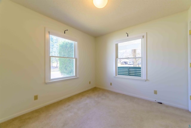 335 E Willow St, Duluth, MN 55811 - empty room with healthy amount of natural light, light colored carpet, and baseboards