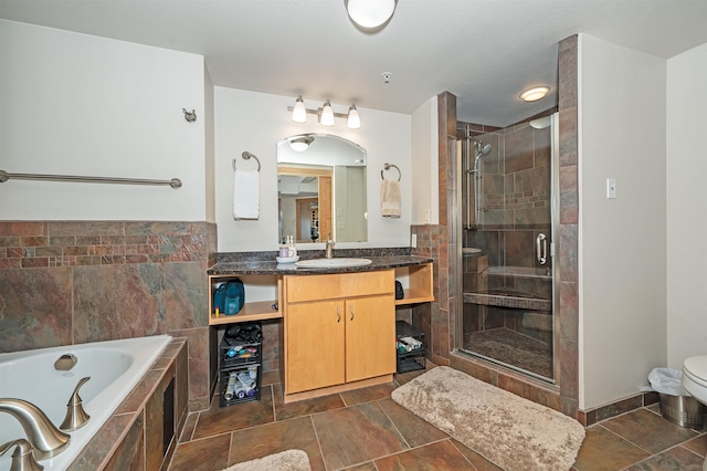 2126 Water St Unit L306, Duluth, MN 55812 - bathroom featuring vanity, a shower stall, a garden tub, and toilet