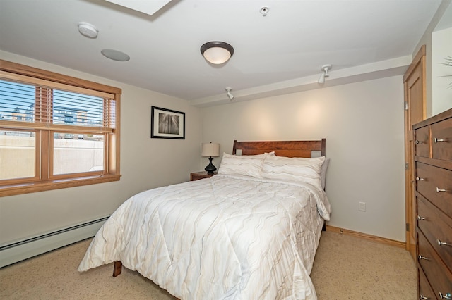 2126 Water St Unit L306, Duluth, MN 55812 - bedroom with a baseboard heating unit and baseboards