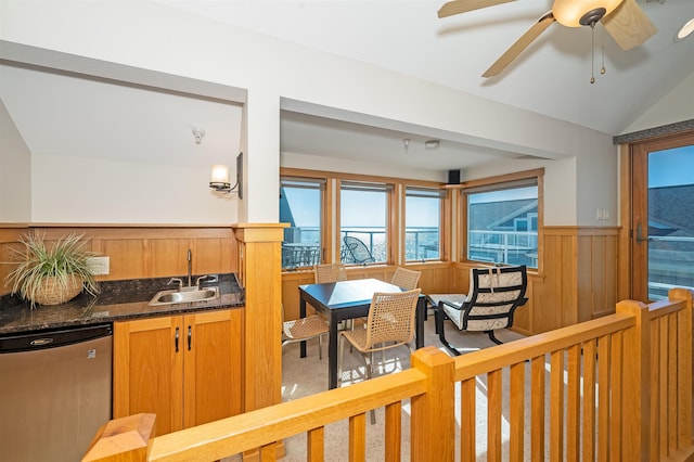2126 Water St Unit L306, Duluth, MN 55812 - kitchen with a sink, dishwasher, a wainscoted wall, lofted ceiling, and brown cabinets