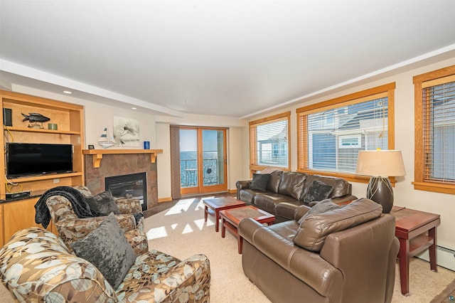 2126 Water St Unit L306, Duluth, MN 55812 - living area with a tiled fireplace, a baseboard radiator, and recessed lighting