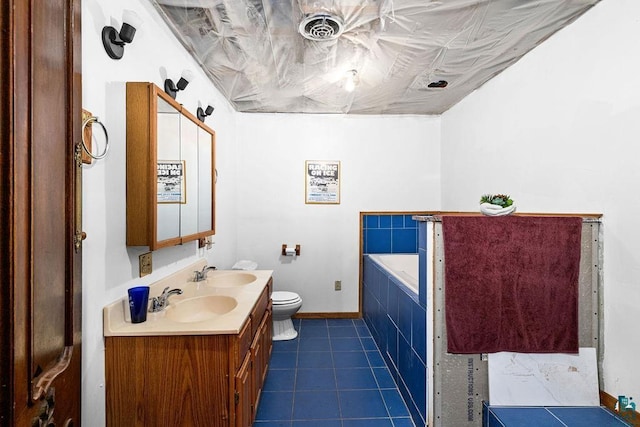 4015 E Van Rd, Duluth, MN 55803 - full bathroom featuring toilet, double vanity, a bath, baseboards, and tile patterned flooring