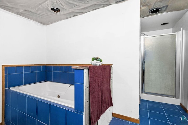 4015 E Van Rd, Duluth, MN 55803 - bathroom featuring a shower stall, a whirlpool tub, tile patterned floors, and baseboards