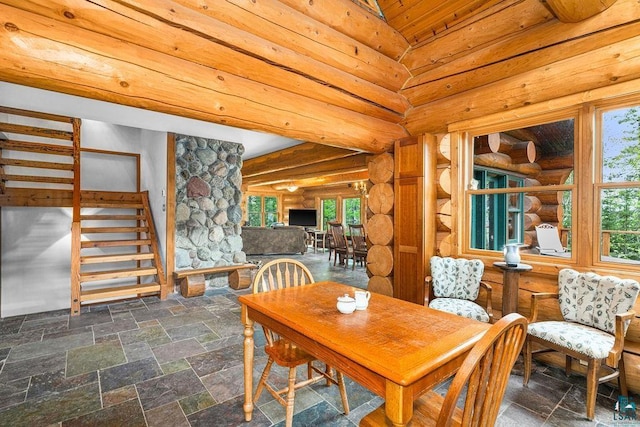 4015 E Van Rd, Duluth, MN 55803 - dining space featuring stairs, rustic walls, stone tile flooring, and wooden ceiling