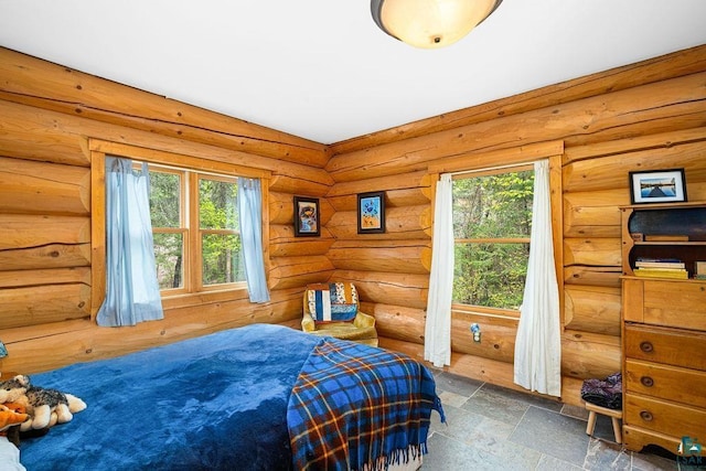 4015 E Van Rd, Duluth, MN 55803 - bedroom featuring multiple windows and stone finish floors
