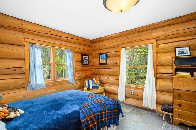4015 E Van Rd, Duluth, MN 55803 - bedroom with multiple windows and stone finish flooring