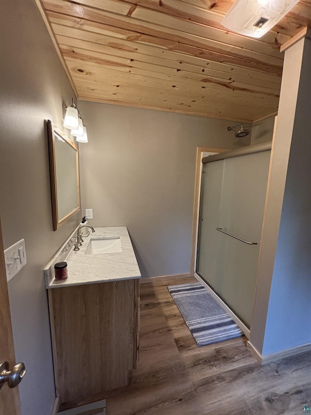 7238 Morris Thomas Rd, Cloquet, MN 55720 - full bath with wood ceiling, a stall shower, vanity, and wood finished floors