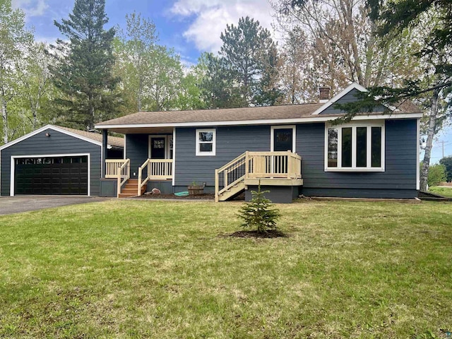 10 Canosia Rd, Esko, MN 55733 - single story home featuring a garage, an outdoor structure, a chimney, and a front lawn