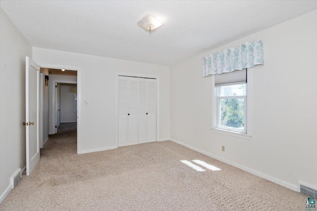 5526 W 8th St, Duluth, MN 55807 - unfurnished bedroom with carpet floors, baseboards, and a closet