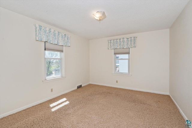 5526 W 8th St, Duluth, MN 55807 - spare room with healthy amount of natural light, carpet, and baseboards