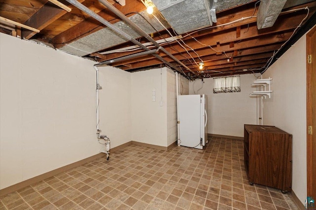 5526 W 8th St, Duluth, MN 55807 - basement with freestanding refrigerator, tile patterned floors, and baseboards
