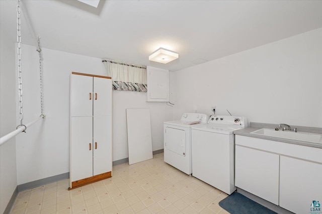 5526 W 8th St, Duluth, MN 55807 - washroom featuring separate washer and dryer, a sink, light flooring, and baseboards
