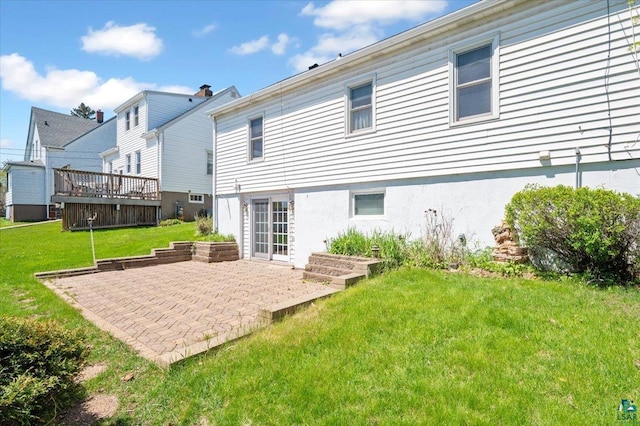 5526 W 8th St, Duluth, MN 55807 - back of property featuring a patio, a yard, and a deck
