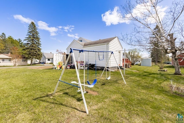 2611 Chambersburg Ave, Duluth, MN 55811 - rear view of property featuring a playground and a lawn